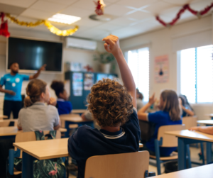 Students engaging in a classroom with the teacher