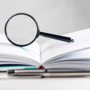 magnifying glass on top of a book